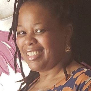 Candi F., smiling