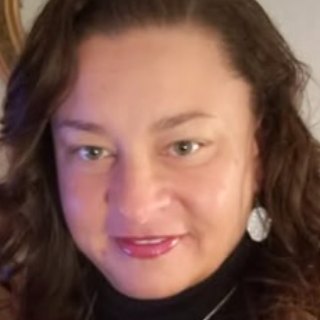Tracey C., smiling